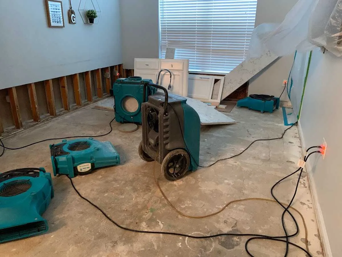 Dehumidifier in flood-cut room for Water Damage Restoration in Albion